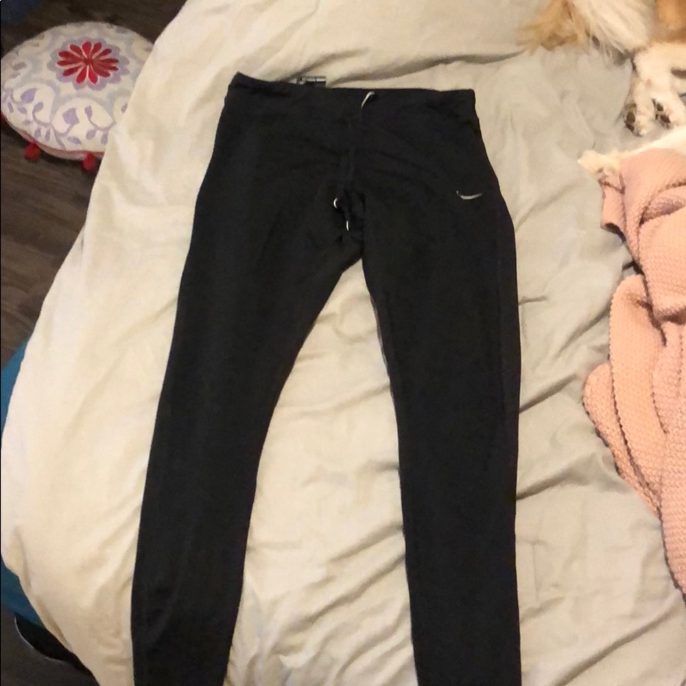 Nike full length leggings with zipped bottoms